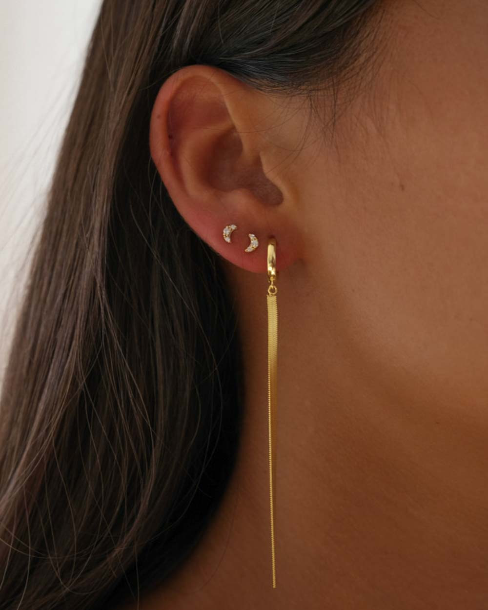 Earrings: Italian Baroque style gold hoop earrings.